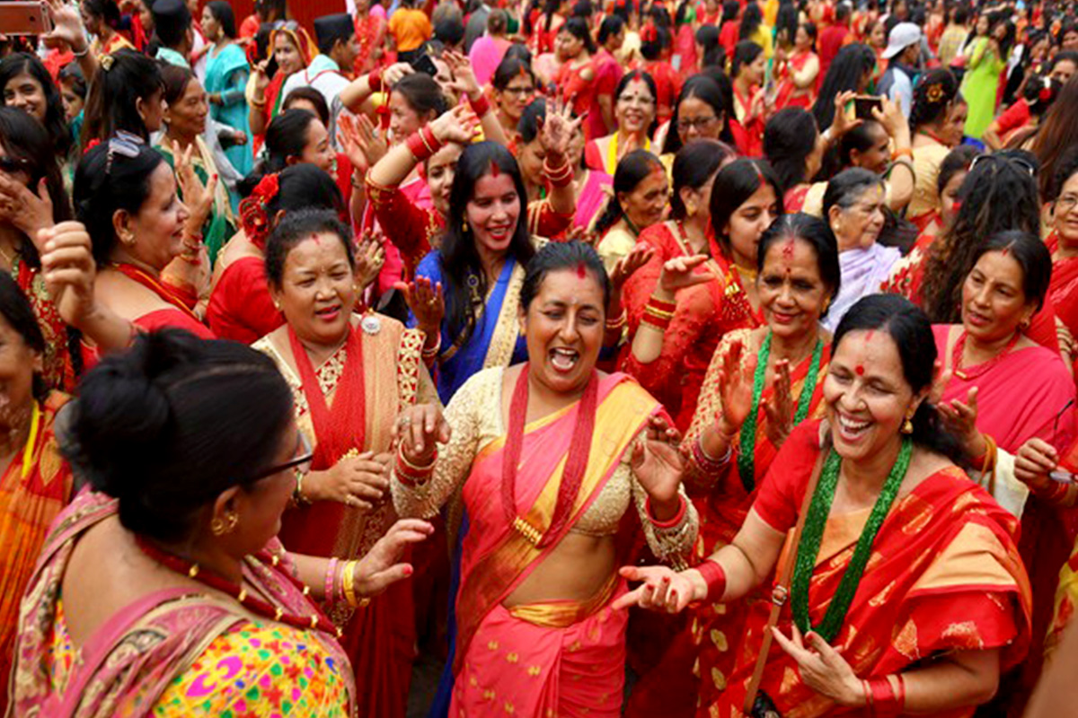 women dancing during teej